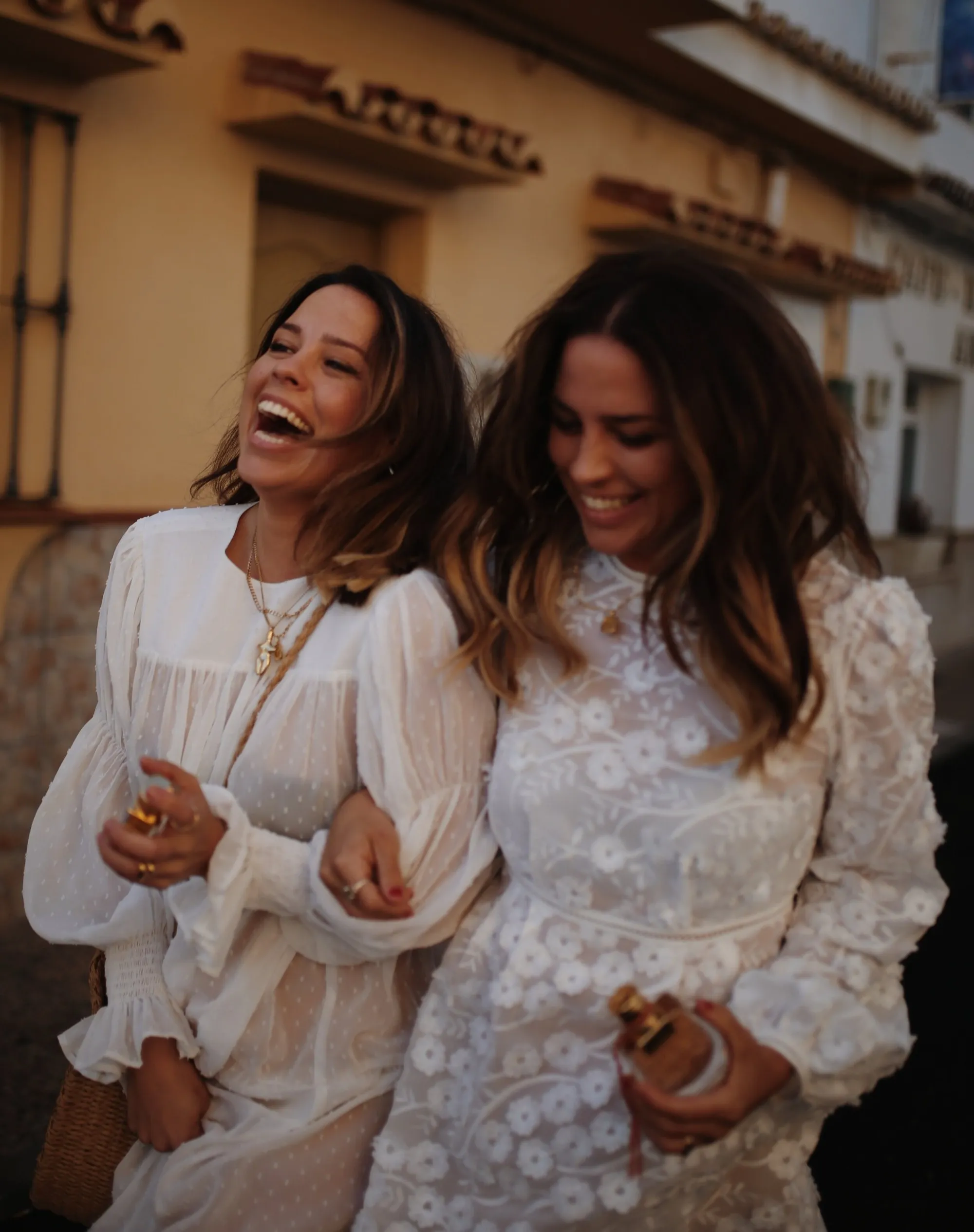 The Collyer Twins laughing together on a photo shoot
